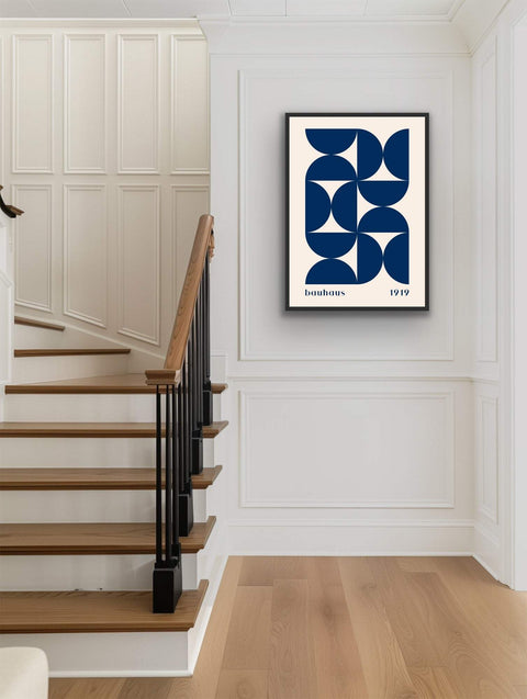 Framed poster featuring bold geometric art in navy blue and Bauhaus style.