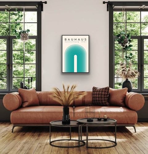 Framed poster of Bauhaus Ausstellung 1923 print in a modern living room setting.