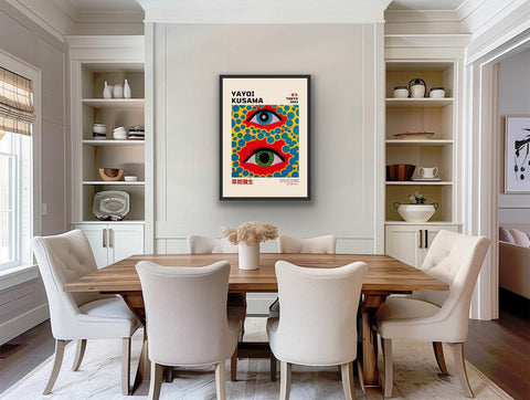 Framed poster of Yayoi Kusama artwork with bold, colorful design in dining room setting.