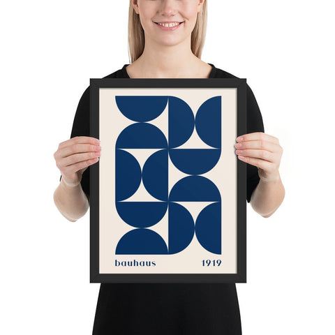 Framed poster featuring navy blue geometric Bauhaus art design.