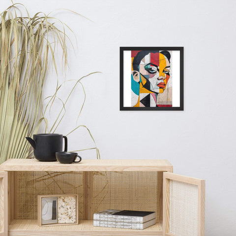 Framed photo paper poster with bold, colorful abstract portrait on wall above table.