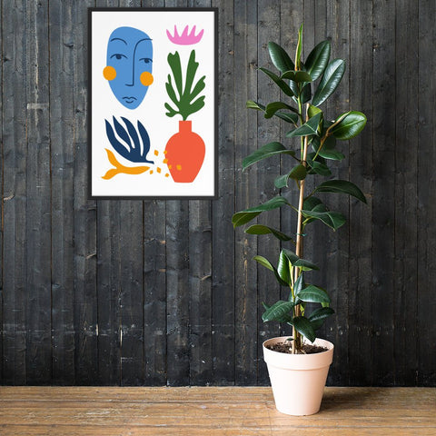 Face & Flora framed poster featuring abstract face and floral designs on black wall with plant.
