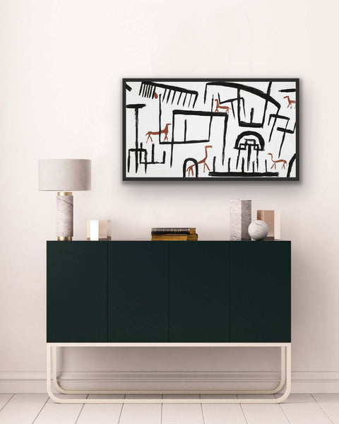 Framed poster above modern sideboard cabinet with elegant base in stylish living space.