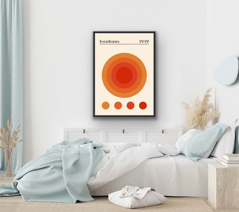 Framed photo paper poster with geometric design and vibrant colors in modern bedroom interior.
