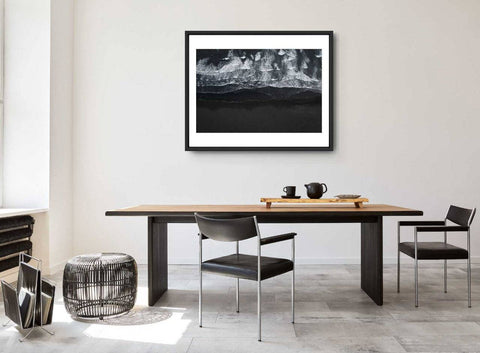Framed abstract poster in modern dining room with contemporary table and chairs.