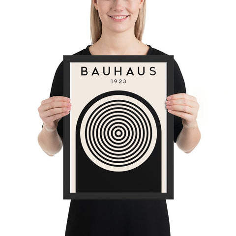 Framed poster with Bauhaus 1923 typography and bold black and white geometric design featuring concentric circles.