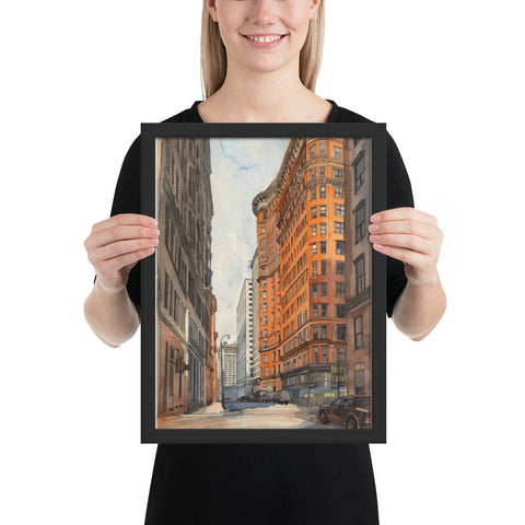 Framed poster featuring a vibrant urban scene, adding sophistication to any room.